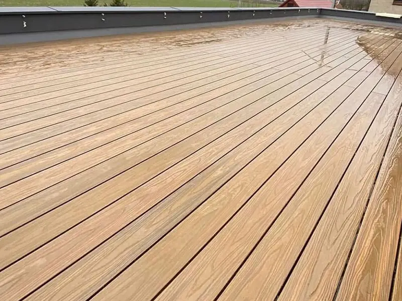 Picture of WPC flooring soaked in heavy rain outdoors