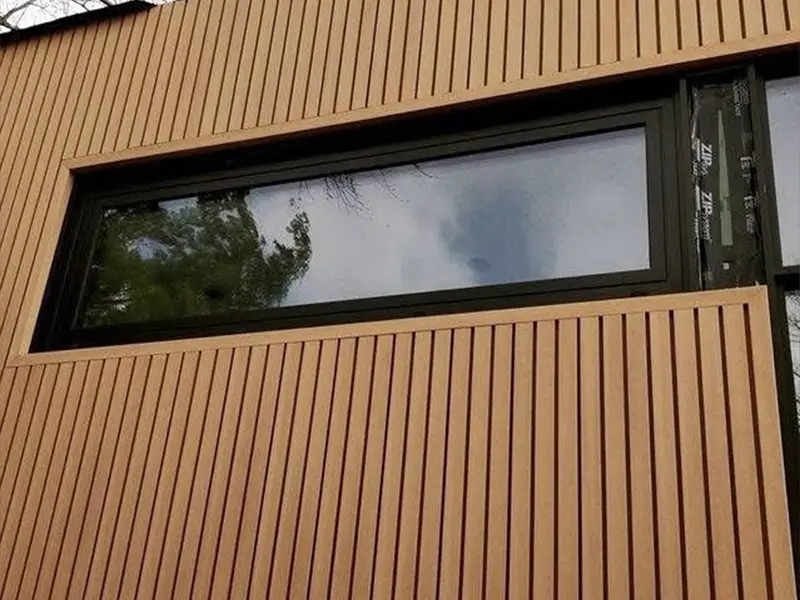 A picture of WPC wall cladding installed outside a store