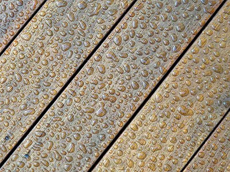 Image of dense water droplets attached to co extruded WPC flooring